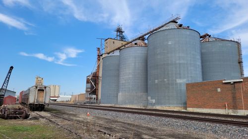 Low angle view of factory against sky