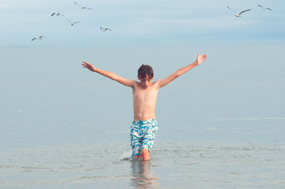 Front view of boy in sea