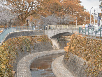 High angle view of arch bridge over canal in city