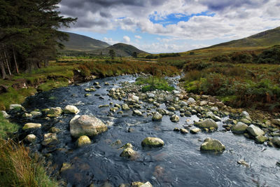 Scenic view of stream against sky