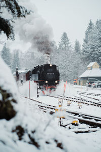 High angle view of train by snowcapped mountains during winter