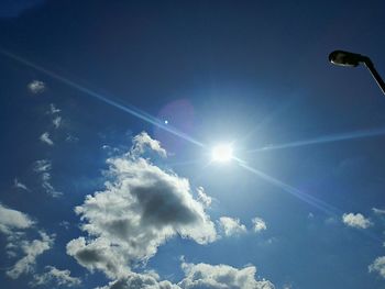 Low angle view of sun in sky