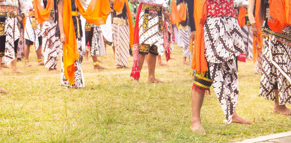 Low section of women standing in park