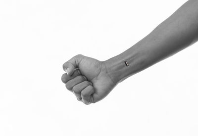 Close-up of hands over white background