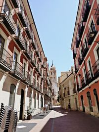 Street amidst buildings against sky