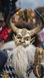 Man dressed as a blue devil dancing at the diablada pillarena parade in pillaro city - ecuador