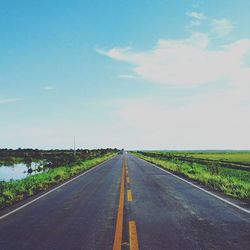 Empty road along landscape