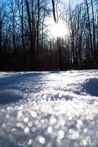 Snow covered landscape against sky