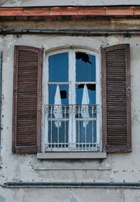 Low angle view of window of old building