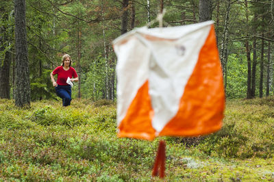 Woman running in forest