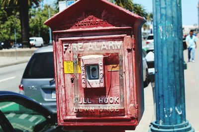 Close-up of red telephone booth in city