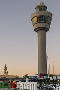 Low angle view of water tower against sky in city