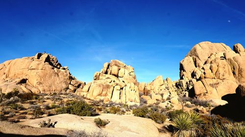 Rock formations against blue sky