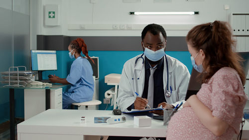 Female dentist working in laboratory