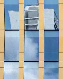 Reflection of building on glass window