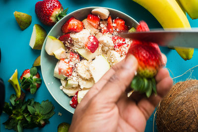 Midsection of woman holding fruits