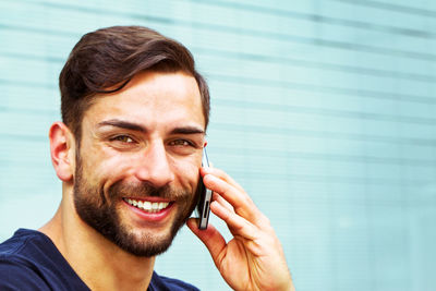 Portrait of young man using smart phone