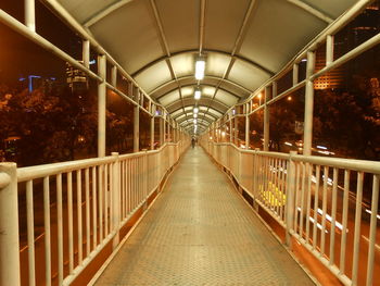 View of elevated walkway at night