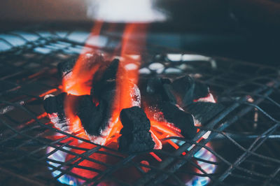 Close-up of burning coal on barbecue grill