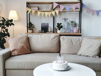 Table and chairs in living room at home