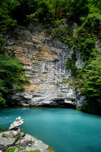 View of river flowing through cliff