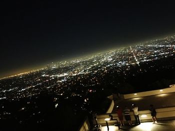 Aerial view of illuminated cityscape at night