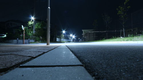 View of illuminated street at night