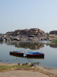 Tourist pleasure boats moored on the tungabhadra river at hampi, karnataka, india. 