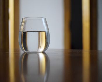 Close-up of beer glass on table