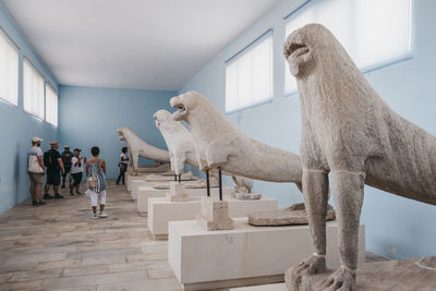 People standing in front of museum