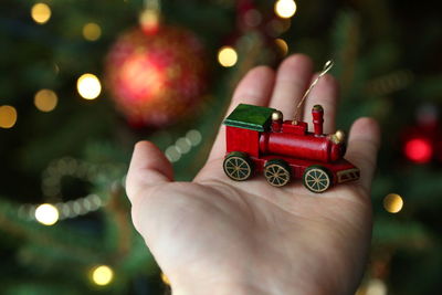 Close-up of woman holding christmas decoration