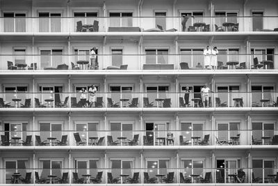 Full frame shot of cruise ship with people standing in balcony