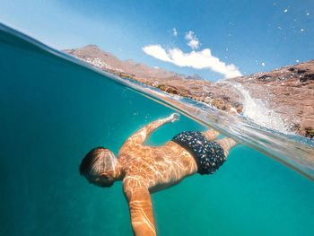 Man swimming in sea