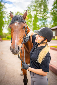 Rear view of woman riding horse