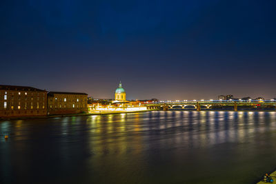 Illuminated buildings at waterfront