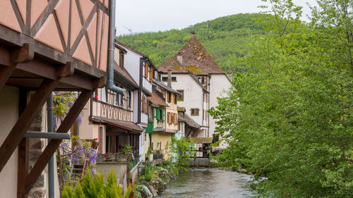 Old houses along the banks of the weiss river in alsace, france