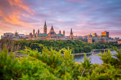 View of buildings against sky at sunset