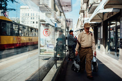 People walking on street in city
