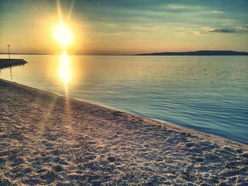 Scenic view of sea against sky at sunset