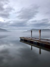 Foggy morning next to lake.  calm. 