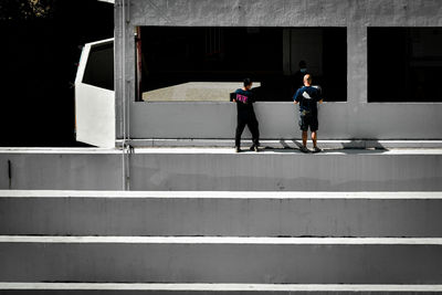 Low angle view of people walking on steps