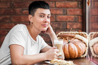 Portrait of woman having breakfast at table