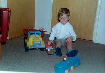 Boy playing with toy car
