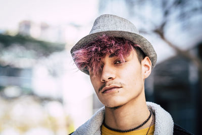 Portrait of young man wearing hat