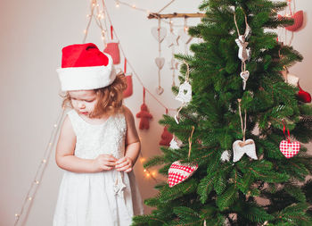 Cute girl with christmas tree