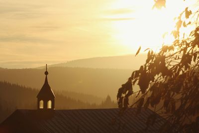 High angle view of silhouette church against sky during sunset