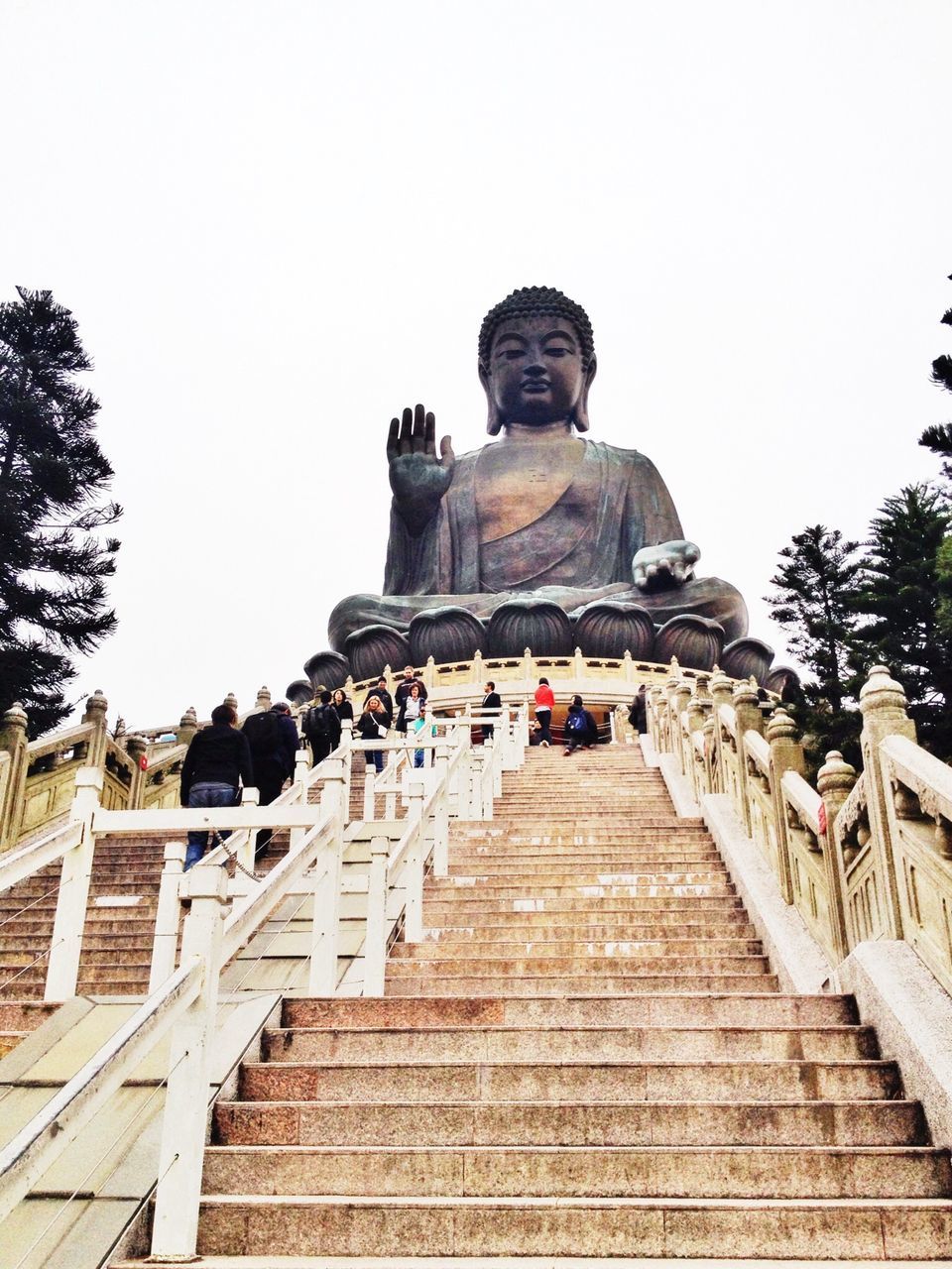 clear sky, statue, human representation, sculpture, art and craft, steps, art, low angle view, built structure, creativity, architecture, travel destinations, tourism, famous place, tree, religion, travel, copy space, sky