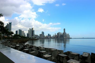 Cityscape against cloudy sky