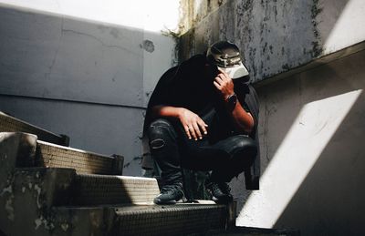Man sitting on stairs