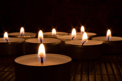 Close-up of illuminated tea light candles